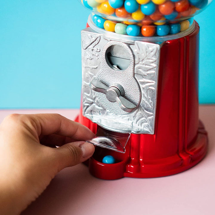Individual setting up a 9 Inch Metal Gumball Machine